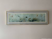 Framed horizontal print showing insects and plants in oriental style with calligraphy and stamps.