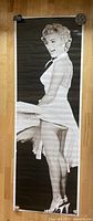 Full view of the monochrome life size Marilyn Monroe poster showing her in a skirt being blown upwards.