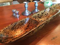 Photo showing the exotic wood carved nut dish, pewter candlesticks, salt and pepper shakers, and vintage hand-painted vase arranged on a table.
