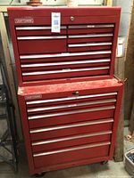 Overall view of red Craftsman rolling toolbox with upper chest stacked on lower cabinet