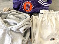 Purple Suns satin jacket, grey Alexander Wang hoodie and off-white Nike track pants displayed together