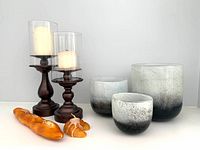 Shows entire lot including 3 gradient glass vases in black/white, pair of wooden candle holders with white candles, and 2 bread-shaped candles
