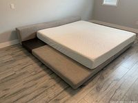 Angled front view showing entire bedframe and mattress