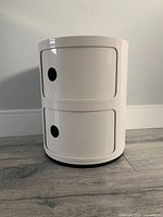 Front view of two stacked white modules with both sliding doors closed