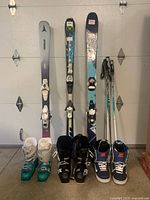 Overall arrangement of skis, snowboard, poles and boots