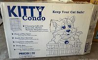 Box showing Kitty Condo branding, key features and safety message for cats