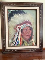 Frontal image of the oil painting featuring the Sioux chief in traditional headdress, showcasing the artwork and frame.