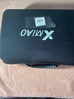 Closed black carrying case with XIVIAO brand logo on top, rectangular shape with handle.