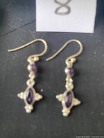 Front view of the silver amethyst earrings showing hook fastening and detailed amethyst stones with silver bead accents