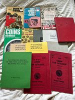 Group shot of all 13 books and booklets laid out