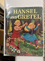 Cover of Hansel and Gretel book showing publisher logo and condition