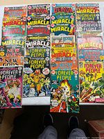 All 27 comics laid out showing variety of titles and issues