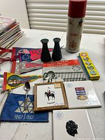 Group shot showing all items including Thermos, shakers, pennants, tiles, candy, fan and spoon