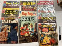 Group shot of nine bagged Dell and Marvel Western comics