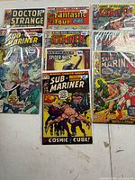 Group shot of all nine Marvel comics in sleeves