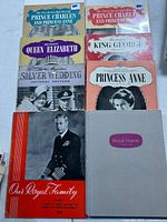 All eight royal family booklets laid out