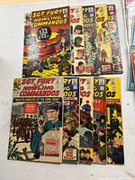 Group shot of all ten comics spread on table