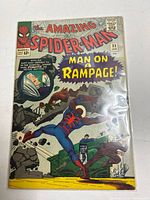 Front cover of The Amazing Spider-Man #32 in bag showing Spider-Man and Aunt May, 12¢ price