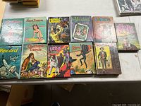 Group shot of 11 Whitman hardcovers