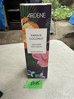 Photo of the unopened box of Ardene Papaya Coconut Diffuser (50ml) showing tropical floral design and label with scent name.