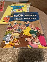 Front of Snow White and the Seven Dwarfs comic book showing colorful cover art with Snow White and the seven dwarfs.