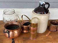Overview of all items including crock jug, glass jar, copper pots, and cup.