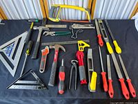 Full lot arranged on black surface showing all tools included with various brands visible
