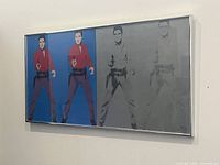 Frontal view of framed diptych artwork showing two colored images of Elvis Presley on left panel and two silver images on right panel.