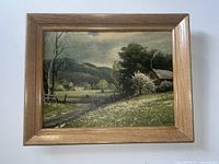 Front view of painting in wood frame