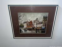Framed print of a vintage Parisian street scene with Moulin Rouge and adjacent buildings, signed Georges B.
