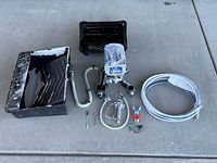 All components laid out on concrete floor