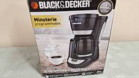 Original box of Black & Decker 12 Cup Programmable Coffee Maker showing product image, brand logo, and product description in multiple languages.