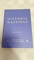 Photo showing the full front cover of the hardcover book Historic Hastings by Gerald E. Boyce, blue cover with gold embossed text.