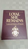 Front cover view of 'Loyal She Remains: A Pictorial History of Ontario' showing maroon cover with gold text and crest.