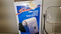 Electric lint remover box shown with product image and details