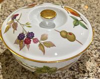 White porcelain covered dish with colorful fruit and leaf designs and gold trim, Royal Sutherland mark visible