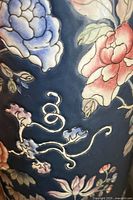 Close-up of blue floral design on the porcelain umbrella stand