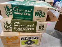 Three original cardboard boxes: WB2 wood base, D2 dust cover, SL95B turntable