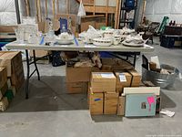 Table top surface with various items on table (not included in sale) showing table size and shape.