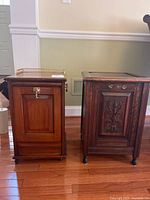 Two vintage wooden side tables placed side by side on hardwood floor, showing overall shape and size difference.