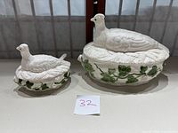 Two ceramic covered bird-shaped serving dishes side by side showing scale and design