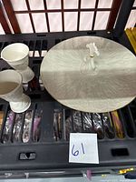 Photo showing Lenox Chateau ivory platter and two Wedgwood egg cups placed on black surface.