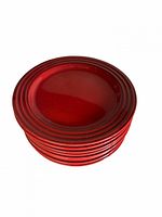 Stack of 8 red ceramic/stoneware plates showing ridged rim design and glossy finish.