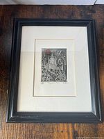 Full view of the framed etching 'Segovian Moon' showing the dark frame and white mat.