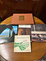 Overview of all four books showing covers and relative sizes.