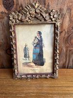 Full view of the antique framed block print showing the entire artwork and ornate wooden frame.