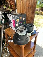 Photo of Instant Pot Air Fryer Lid, accessories including crisper basket, air fryer basket, multi-use rack, and original Instant Pot box