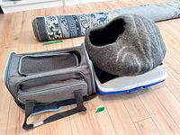 Gray PETSFIT mesh pet carrier with ventilation mesh panels, handles, and shoulder strap, shown from side and top views.