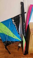 Two trick kites with spars, lines and bags visible