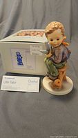 Figurine with box and information card